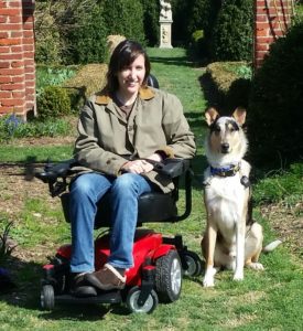 service dog trainer in wheelchair with a service dog